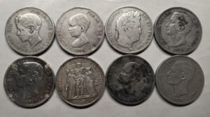 Lote de moneda 0.900 a spot -1%