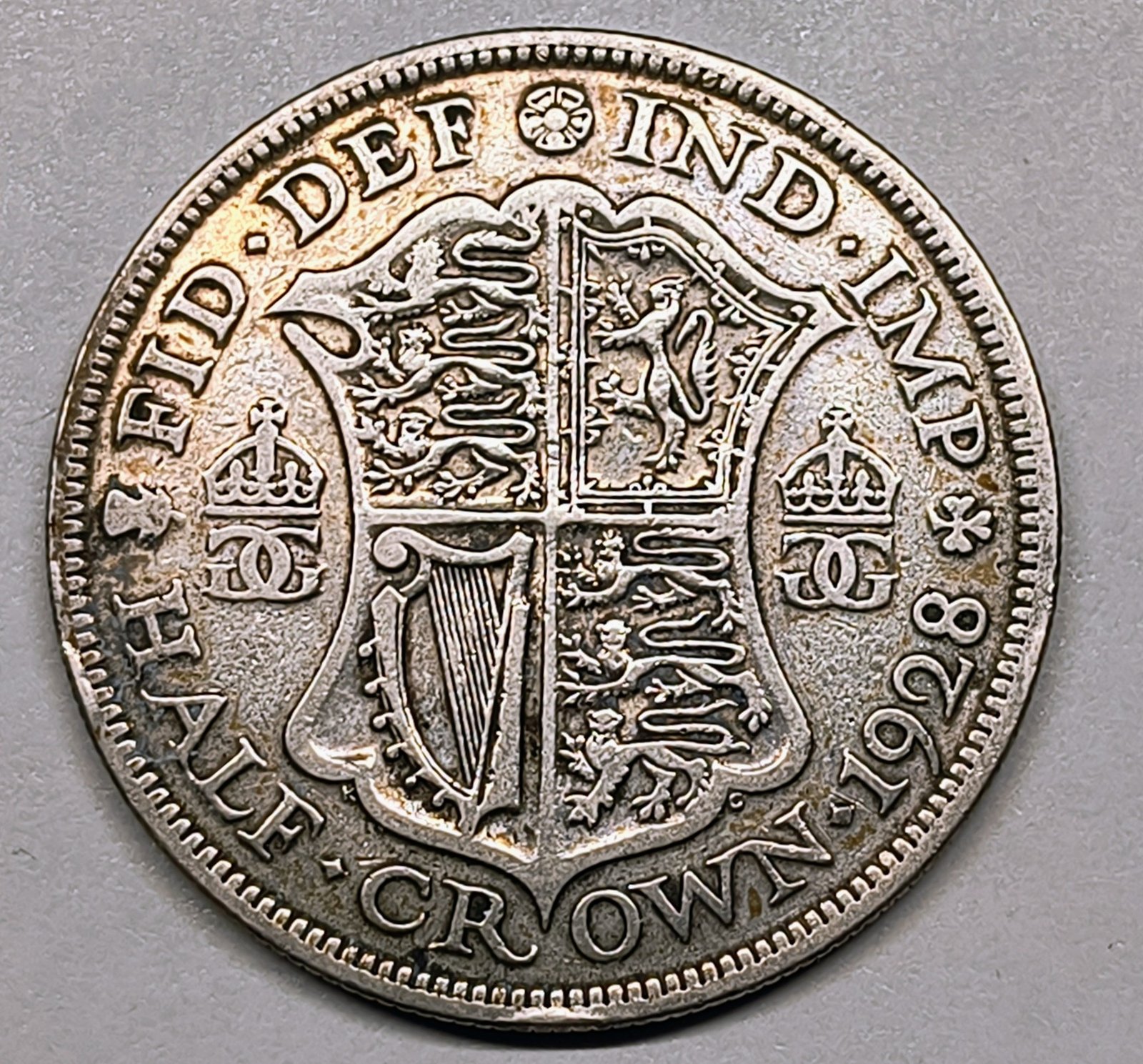 Half Crown George V 1928 Reino Unido · Plata 0,500 · ArgentumSun — Reverso